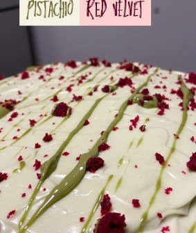 A white-glazed slab drizzled with pistachio and scattered with dried rose petals.